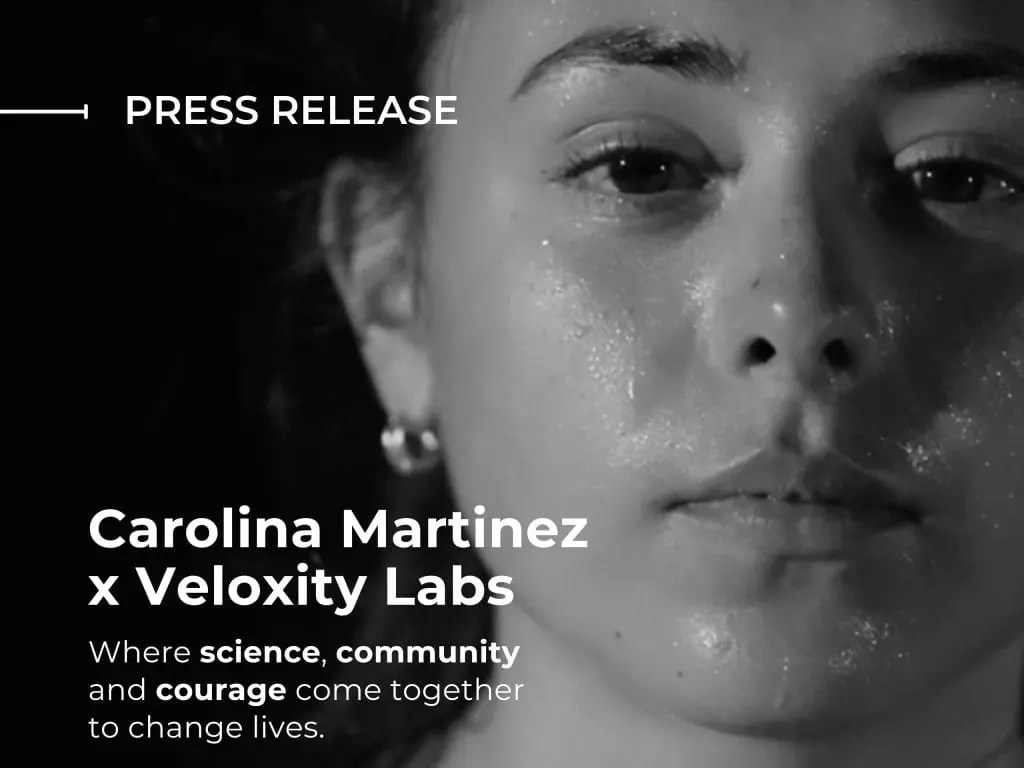 Press release graphic featuring a close-up portrait of Carolina Martinez announcing a collaboration between Carolina Martinez and Veloxity Labs.